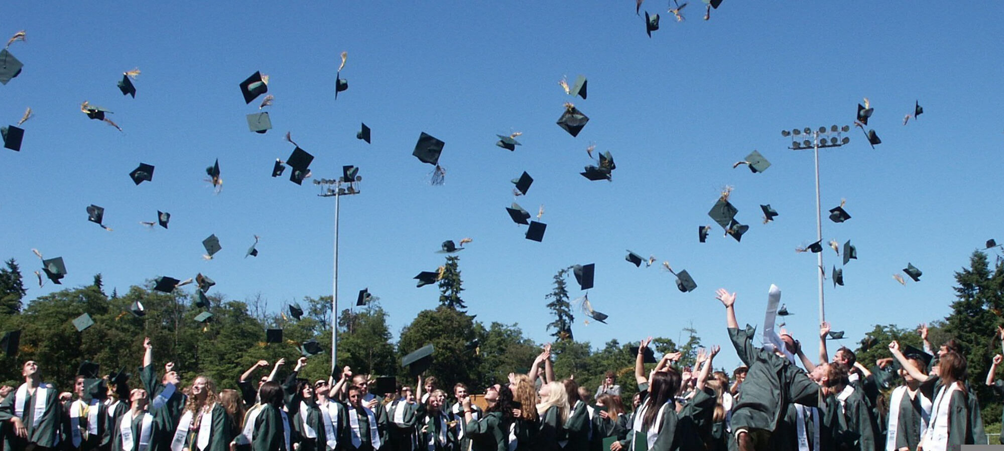 graduates caps in the air 