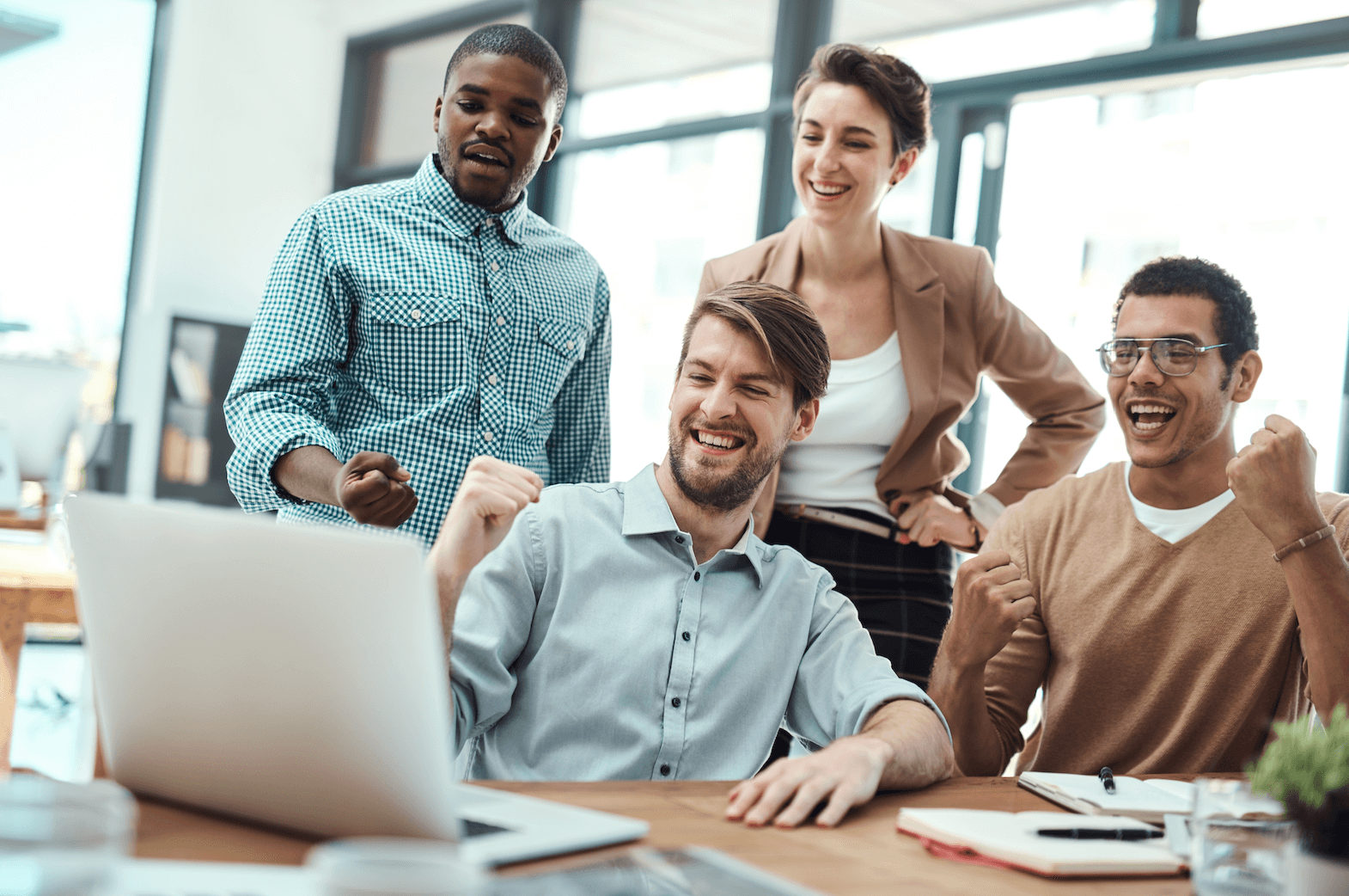 team looking at a shared computer screen 